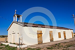 Old Abandoned Church In Disrepair & With Boarded Up Windows