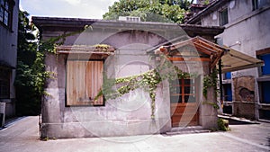 Old abandoned closed market with wooden door and window