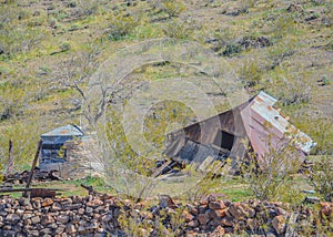 Old abandoned collapsed structure and ruins of a water storage tank in Oatman on U.S. Route 66. Oatman, Mohave County, Sonoran Des