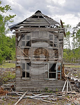 Old abandoned collapsing house cloudy day