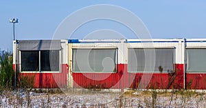 Old abandoned container building with windows in the middle of nowhere