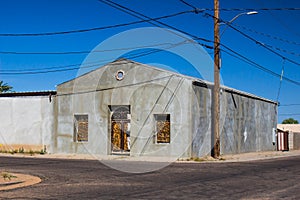 Old Abandoned Corner Building With Ornate Wrought Iron Window & Door Grates