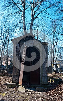 Old abandoned crypt with brocken door photo