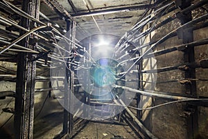 Old abandoned dark concrete underground cable tunnel