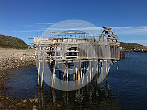 Old abandoned and destroyed wooden structure on stilts