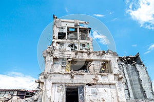 Old abandoned dirty comunism factory building during demolition