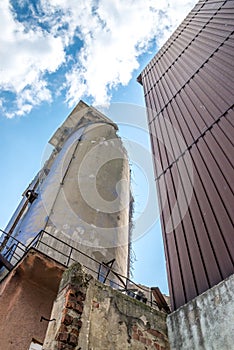 Old abandoned dirty comunism silo for sand and silicon during demolition