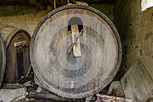 Old abandoned dusty wooden barrel