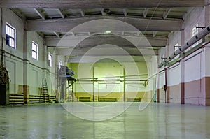 Old abandoned empty production hall, factory interior