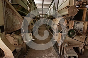 Old abandoned factory, rusty industrial machinery background