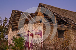 Old abandoned farm brick building