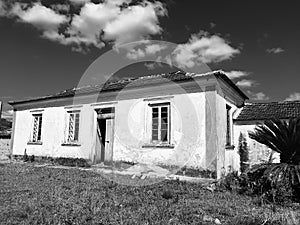 Old abandoned farm house black and white