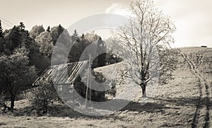 Old abandoned farm house under the hill