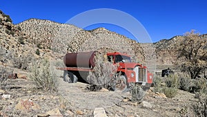 Old abandoned farm water tank truck mountain desert HD