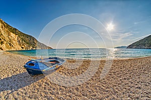 Old Abandoned Fishermen Boat at Sunset Myrtos Beach in Kefalonia, Greece