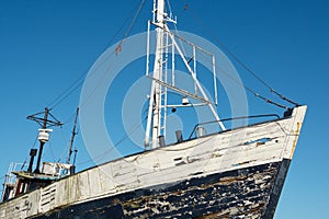 Old abandoned fishing boat ashore