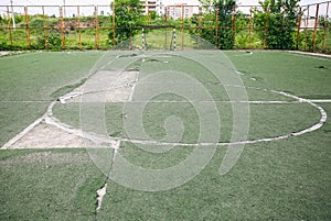 Old abandoned football pitch. Urban photo of destruction