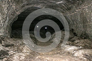 Old abandoned galleries, adits, for extraction and processing of natural stone and gypsum cave. Dark eerie stone, quartz tunnels