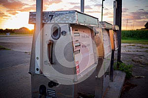 Old Abandoned Gas Pumps at Sunset