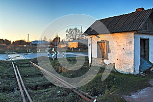 Old abandoned grainery at edge of railroad tracks