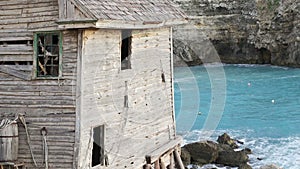 Old abandoned house and the blue lagune sea