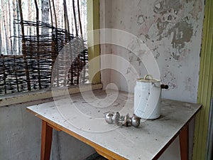 old abandoned house, enamel can, wicker fence, slum