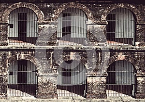 Old abandoned house with gratings on the windows