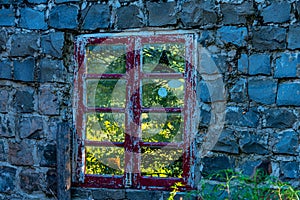 Old and abandoned house overgrown with vegetation