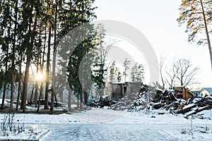 An old abandoned house in a pine winter forest