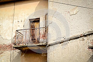 Old abandoned house and rusty terrace