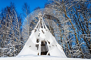 The old abandoned hut, covered with snow