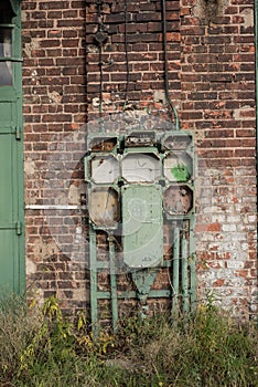 Old abandoned industrial building with electrical switchboard