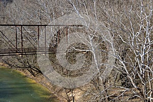 Old abandoned iron bridge over locust fork river in warrior alabama