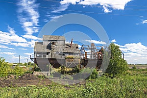 Old abandoned kolkhoz wooden grain elevator