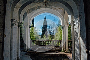 Old abandoned mansion. Balcony with columns and beautiful view to the park and black sea