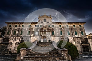 Old abandoned mansion during a frightening storm.