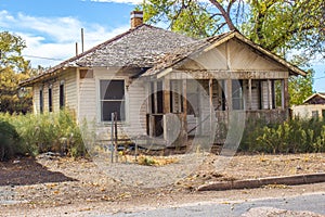 Old Abandoned One Level House In Disrepair photo