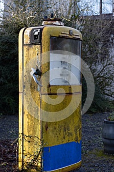 Old abandoned petrol gas pump at side of road