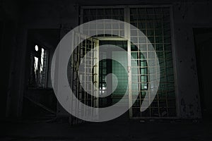Old abandoned prison cell in the dark