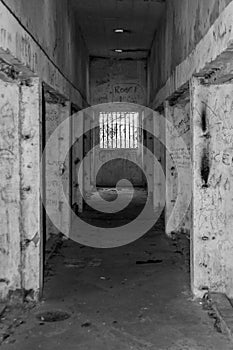 Old abandoned prison hall window bars jail