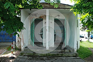 Old abandoned public toilet. Dirty architecture