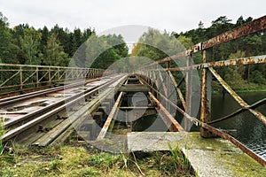Old abandoned railroad bridge above river