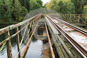 Old abandoned railroad bridge above river in Poland