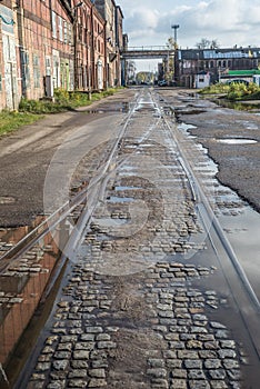 Old abandoned railway tracks and industrial building