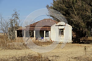 Old abandoned red roof farm house.