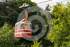 Old abandoned red rusty cable car