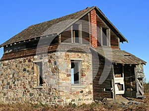 Old abandoned rock farm house
