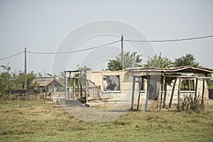 Old abandoned and ruined clay house in Letea village,  in the Danube Delta area,  Romania,  in a sunny summer day