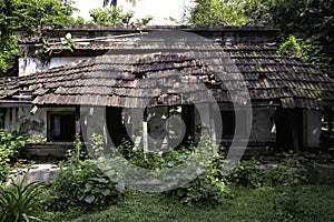 Old abandoned ruined house covered in vegetation at rural area of west bengal