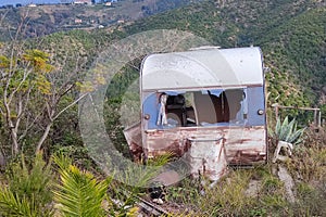 Old abandoned rusted roulotte Rv van